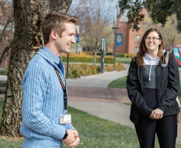 Staff member leads a campus tour